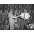 Izzy Shopsowitz and Woody Herman, [197-?]. Ontario Jewish Archives, Blankenstein Family Heritage Centre, fonds 37, series 4, item 44.|Izzy [Isaac] Shopsowitz was co-owner, along with his brother Sam, of Shopsy's Delicatessan. He was a member of Toronto's Beth Tzedec Synagogue. Woody (Woodrow) Charles Herman (1931-1987) was a well-known jazz musician and big band leader.